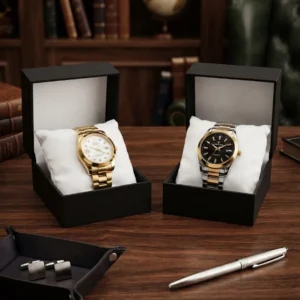 Gold diamond dial watch and two tone steel watch displayed in open gift boxes